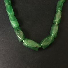 Meticulously crafted with 32 exquisite green jade beads. This opulent piece exudes timeless sophistication and unparalleled beauty. Perfect for special occasions or as a distinguished gift. Great condition! Elegant Faceted Jade Necklaces, Elegant Jade Beads As Gift, Elegant Green Beaded Necklaces With Polished Beads, Elegant Green Polished Beads, Elegant Jade Jewelry With Large Beads, Faceted Green Oval Beaded Jewelry, Elegant Jade Beads For Jewelry Making, Traditional Green Jade Beaded Necklaces, Elegant Green Onyx Beaded Necklaces