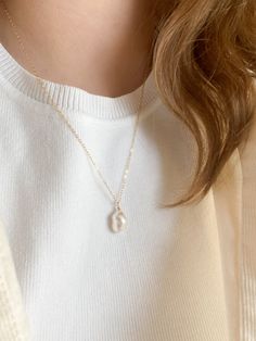 This necklace is 20 inches long. The perfect minimal necklace to wear with any outfit. The Pearl is unique and is cultured. The chain and other components are gold filled, a thick layer of gold over the base metal. This piece is safe to wear in water, but should stay away from any chemicals. Everyday White Single Strand Necklace, Everyday Pearl Necklace With Adjustable Chain, Everyday White Pearl Chain Charm Necklace, Classic White Necklace For Everyday, Minimalist White Chain Necklace For Everyday, Simple Pearl Necklace As Gift, Dainty Everyday Pendant Necklace, Everyday White Chain Necklace With Round Pendant, Everyday Adjustable Necklace With Pearl Charm