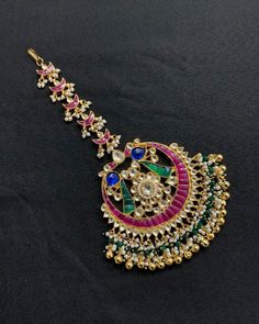 *It's Handmade Kundan Mangtikka for Indian Brides. *It's made from Silver n Copper with Pink,Green and White Kundan Stones Settings with 22k gold Plating as shown in picture. *It's 2 Inch size. *Our all jewelry is made from semiprecious stones and beads. *WARRANTY: ITS GENUINE HANDMADE JEWELRY AND WE ARE GIVING LONG LIFE WARRANTY FOR OUR ALL ITEMS. All of our Kundan Jewelry is 100% handmade with ancient Kundan stone setting method using silver foils. It is one of the most favorable jewelry since Kundan Bridal Accessories With Tilla For Marriage, Tilla Tikka For Marriage And Festivals, Bollywood Bridal Accessories For Marriage, Festive Bridal Accessories With Tilla For Marriage, Temple Jewelry Tikka For Marriage And Festivals, Traditional Bridal Accessories With Stone Work For Marriage, Traditional Festive Wedding Hair Accessories, Traditional Kundan Bridal Accessories, Traditional Kundan Tikka For Marriage