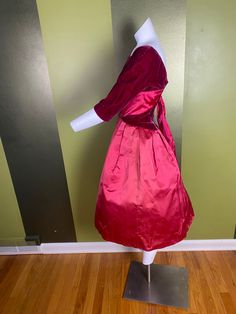 "Gorgeous velvet and satin Kay Selig gown with bubble skirt. Color is hard to capture: I'd call it a deep raspberry color. Stiff skirt, lined with heavy interfacing. Velvet on one shoulder has a small pressed spot. I have not tried steaming to get wrinkles out Women's xs 34\" bust 24\" waist Skirt length: 27\"" Vintage Evening Dresses With Bow, Red Satin Vintage Dress, Vintage Burgundy Dress For Evening, Vintage Burgundy Evening Dress, Burgundy Vintage Evening Dress, Vintage Taffeta Ball Gown Dress, Vintage Velvet Dress With Fitted Bodice, Velvet Vintage Dress For Vintage Events, Vintage Satin Dress With Pleated Bodice