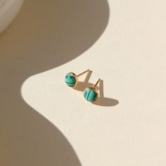 14k gold fill Malachite Studs placed in the sunlight. These Earrings feature Malachite gemstone. Hypoallergenic 14k Gold Green Jewelry, Hypoallergenic Green 14k Gold Jewelry, Nickel Free 14k Gold Filled Green Jewelry, Nickel-free 14k Gold-filled Green Jewelry, Nickel Free Green Jewelry In 14k Gold Filled, Nickel-free Green Jewelry In 14k Gold-filled, Nickel-free Green Jewelry In 14k Gold Filled, Dainty Green Birthstone Jewelry, Everyday Turquoise 14k Gold Jewelry