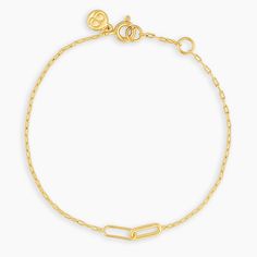 This paperclip chain bracelet features two cool interlocking links at its center. We love this easy bracelet worn alone or with the matching Zoey Necklace. Product Details 6 3/4" chain + 1/2" extender. Adjustable in 1/2 inch increments 6 3/4" - 7 1/4" Link charms measure 1/8" by 3/8" Spring ring closure Available in 18k gold plated brass Avoid contact with anything containing derivatives of alcohol | Zoey Bracelet in Gold, Women's by gorjana Classic Gold Charm Bracelet With Jubilee Style, Classic Gold Charm Bracelet With Jubilee Bracelet, Classic Gold Charm Bracelet With Jubilee Detail, Everyday Gold-tone Paperclip Bracelet With Cable Chain, Timeless Adjustable Chain Bracelet For Everyday, Adjustable Timeless Chain Bracelet For Everyday, Dainty Yellow Gold Link Bracelets, Dainty Oval Link Yellow Gold Bracelets, Timeless Gold Bracelets With Rectangular Links