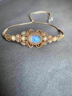 This macrame choker is made of high-quality waxed cord，natural rainbow Labradorite . Moonstone is the June birthstone and would make a very special gift for a June birthday girl. It is a unique idea for a special gift for her or a treat for yourself. It is a unique idea for a special gift for her or a treat for yourself. Length: adjustable 32CM -78CM Materials: moonstone Wax cord:0.8mm Please do not hesitate to contact me if you require further information. I will be glad to help Bohemian Moonstone Beaded Jewelry, Adjustable Beaded Moonstone Jewelry, Festival Macrame Moonstone Jewelry, Adjustable Moon Shaped Bohemian Jewelry, Mystical Adjustable Moonstone Crystal Necklaces, Adjustable Mystical Moonstone Crystal Necklace, Adjustable Bohemian Moonstone Crystal Necklace, Adjustable Moon-shaped Bohemian Jewelry, Bohemian Moon-shaped Adjustable Jewelry