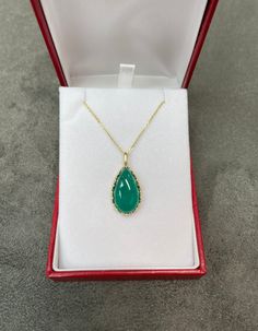 Featured here is a stunning, pear cabochon Colombian emerald pendant in fine 14K yellow gold. Displayed is a deep-green emerald prong-set in a prong setting. The earth mined, green Colombian emerald has an incredible green color with clean clarity considering its whopping size. This is an excellent gift for a May baby or for someone who simply loves emeralds. Total Carat Weight: 16.57cts Setting Style: Prong Set Setting Material: 14K Yellow Gold Main Stone: Emerald Shape: Pear Cut: Cabochon Weig Luxury Pear-shaped Emerald Gemstone Necklace, Pear-shaped Emerald Gemstone Necklace For Formal Events, Pear-shaped Emerald Gemstone Necklace For Formal Occasions, Fine Jewelry With Cabochon Drop, Fine Jewelry Drop Cabochon, Briolette Emerald Necklace For Formal Occasions, Formal Emerald Briolette Necklace, Formal Briolette Emerald Necklace, Formal Drop Emerald Gemstone Necklace