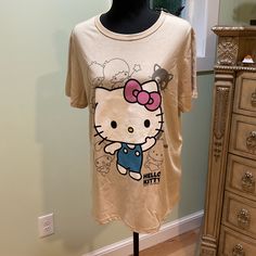 Brand New! Absolutely Adorable! Featuring Hello Kitty And All Your Favorite Sanrio Friends! Super Soft! Size L Cute Brown Crew Neck T-shirt, Brown Cotton Top With Cartoon Print, Brown Cotton Tops With Cartoon Print, Cute Beige Crew Neck T-shirt, Cute Brown Short Sleeve T-shirt, Hello Kitty And Friends, Shirt Color, Caramel, Colorful Shirts