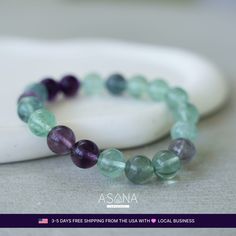 Illuminate your path with the Colorful Fluorite Beaded Bracelet by Asana Crystals. Each 10mm round bead of natural Colorful Fluorite radiates harmony, balance, creativity, intuition, and transformation. Let this vibrant masterpiece be your guide to self-discovery, joy, and spiritual growth.                	Crystal: Natural Colorful Fluorite  	Type: Beaded Stretch Bracelet  	Bead Size: 10 MM  	Bracelet Size: 7 Inches  	Wrist Size Range: 6 to 7  	Bead Shape: Round  	Closure: None  	Other Mate Spiritual Fluorite Crystal Bracelet For Healing, Handmade Fluorite Beaded Bracelets As Gift, Fluorite Gemstone Beads Bracelets For Healing, Fluorite Gemstone Beads Bracelet For Healing, Handmade Spiritual Fluorite Bracelet, Fluorite Bracelet, Crystal Guide, Cleansing Crystals, Tourmaline Bracelet