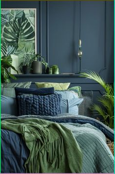 a bedroom with blue walls and green plants