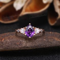 Amethyst Engagement Ring Unique Triangle Cut Moissanite Cluster Wedding Ring Art Deco Pear Shaped Purple Gemstone Rose Gold Bridal Ring RING DESCRIPTION ✦Engagement Ring ✴Center Stone - Amethyst Shape - Pear Cut Size - 6x8mm ✴Side Stones - Moissanite & Alexnadrite Shape - Triangle & Round Cut Weight - 0.26ct ✴Band Width - About 1.5mm ✴Ring Metal: Available in rose gold plated, yellow gold plated, 925 sterling silver, 10k or 14k solid rose, yellow or white gold. MAKING & SHIPPING ✦PAYMENT PLAN ♡ Purple Engagement Ring, Amethyst Engagement Rings, Purple Engagement Rings, Light Summer Color Palette, Cluster Wedding Ring, Wedding Ring Art, Wedding Rings Art, Amethyst Engagement Ring, Moon Wedding