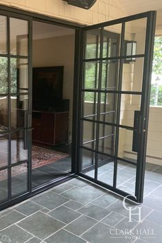 an open glass door leading into a living room