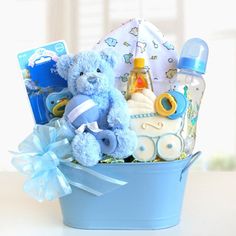 a baby boy gift basket with a teddy bear