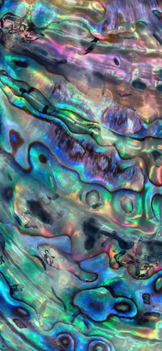 an abstract painting with blue, purple and green colors on it's surface is shown