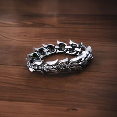 The Viking Wolf Stainless Steel Bracelet from Vikings Jewelry is a stylish and durable accessory that combines the robustness of stainless steel with the fierce symbolism of the Viking Wolf. This bracelet features a striking wolf design carved into stainless steel, creating a striking contrast between the polished steel and the intricate wolf details. Made of stainless steel, it is resistant to rust and fading, making it an accessory that can be used for a long time. A perfect gift for Viking lo Vikings Jewelry, Viking Wolf, Punk Accessories, Wolf Design, Cotton Swab, Viking Jewelry, Water Stains, Steel Bracelet, Charm Bracelets