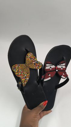 Beautifully crafted sandals made with fine beads and 100% pure leather. The sandals are very comfortable when worn and the finishing is excellent. It is such a perfect gift for you or a loved one . We can customize for you to any colour. Also sold in bulk at very good discount. Thank you for visiting our shop! Leather Toe Post Slippers For The Beach, Adjustable Leather Slippers, Beach Slip-on Wedge Sandals With Leather Sole, Leather Sole Slip-on Wedge Sandals For Beach, Slip-on Wedge Sandals With Leather Sole For Beach, Multicolor Leather Sole Sandals For Beach, Multicolor Leather Wedge Sandals For Beach, Leather Wedge Sandals With Single Toe Strap For Beach, Traditional Sandals With Leather Sole For Beach