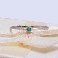 "RING DETAIL Metal : 925 sterling silver Center stone : Emerald Size of stone : 2.5mm Shape : Round About gems stone Emerald Emerald is a valuable gemstone that is likewise referred to by different names, for example, \"Panna\", \" Zamarrud\", \"Maragdam\", and \"Greenstone\" The tone changes from green to greenish-blue. It has a place with the mineral Beryl, the green is brought about by the presence of chromium, vanadium or iron (or any blend of those three components) and incorporates sea blu Green Sterling Silver Stackable Promise Rings, Minimalist Sterling Silver Emerald Ring For Gift, Sterling Silver Stackable Emerald Ring As Gift, Sterling Silver Stackable Rings With May Birthstone, Sterling Silver Emerald Ring With Round Band As Gift, Emerald Ring With Sterling Silver Round Band As Gift, Green Sterling Silver Minimalist Ring, Minimalist Green Birthstone Ring In Sterling Silver, Minimalist Green Sterling Silver Birthstone Ring