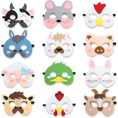 a bunch of masks that are on top of a white surface with different colors and shapes