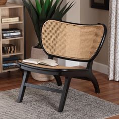 a chair sitting on top of a wooden floor next to a book shelf filled with books