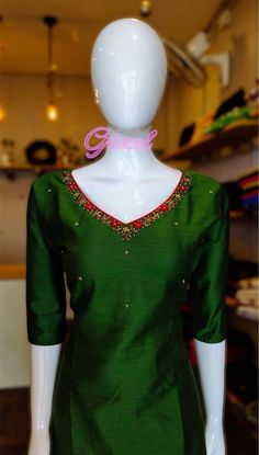 Bottle green color cotton silk kurta with cotton lining . Beautiful thread and beaded work on the neck. sleeve length:3/4th kurti length:46 Thread Work Neck Designs For Kurtis, Green Zari Work Kurta In Cotton Silk, Green Cotton Silk Kurta With Zari Work, Bollywood Style Kurta With Embroidered Neckline For Diwali, Diwali Traditional Wear Straight Kurta With Embroidered Neckline, Festive Bollywood Salwar Kameez With Embroidered Neckline, Traditional Salwar Kameez With Embroidered Neckline, Traditional Chanderi Kurta With Embroidered Neckline, Green Cotton Silk Kurta With Dabka Work