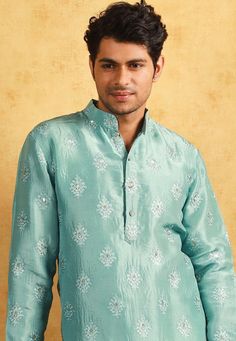 Art Upadda Silk Kurta in Sea Green. This Readymade Chinese Collar Neck and Full Sleeve attire is Enhanced with Fancy Buttons, Resham and Sequins Work Available with a Cotton Silk Aligarhi Pant in White Do note: Footwear shown in the image is for presentation purposes only. Half to one inch may vary in measurement. (Slight variation in actual color vs. image is possible) We sell all kinds of menswear. Mens Kurta | Mens Kurta Pajama | Mens Sherwani | Mens Sherwani Sets | Traditional Menswear | Par Reception Kurta With Dori Work In Raw Silk, Raw Silk Kurta With Dori Work For Reception, Reception Raw Silk Kurta With Dori Work, Art Silk Straight Kurta For Reception, Chanderi Kurta For Reception And Festivals, Art Silk Kurta For Navratri Reception, Straight Kurta For Reception And Navratri, Art Silk Kurta For Reception And Navratri, Raw Silk Kurta For Reception And Navratri