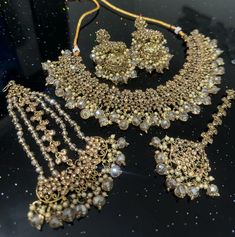 T A R A H 2053 Stunning Champagne Gold Crystal Necklace Set includes Jhumkey Earrings, Tikka and Jhumer  Antique Gold Finishing  Stunning Set perfect for any Wedding, Party Function Hand Set Gold Bollywood Bridal Accessories, Bollywood Style Gold Bridal Accessories With Hand Set Details, Bollywood Gold Bridal Accessories With Intricate Design, Gold Chandbali Bridal Accessories Hand Set, Gold Chandbali Hand Set Bridal Accessories, Gold Chandbali Bridal Accessories With Stone Work, Gold Bridal Sets With Stone Work For Celebration, Festive Gold Bridal Accessories With Hand Set, Gold Kundan Bridal Accessories For Celebration