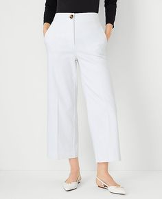 Elevate your wardrobe with the chic sophistication of Ann Taylor's The Kate Wide Leg Crop Pant. Perfectly tailored to flatter your figure, these pants boast a high-rise fit that sits just below the natural waist and a wide leg silhouette that adds a modern twist to your ensemble. The crisp white color enhances its versatility, making it a must-have for any fashion-forward wardrobe.

- Size: 4
- Color: White
- Gender: Female
- Material: 52% Cotton, 45% Polyester, 3% Elastane
- Fit: Tailored and f White Cropped Wide Leg Pants For Work, Elegant Cropped Wide Leg Pants For Spring, Tailored Wide Leg Ankle-length Pants For Spring, Classic Wide Leg Culottes For Spring, Tailored Ankle-length Wide Leg Pants For Spring, White Cropped Leg Workwear Bottoms, White Cropped Leg Bottoms For Work, Spring Workwear Wide Leg Pants With Straight Hem, Spring Wide Leg Pants For Workwear With Straight Hem