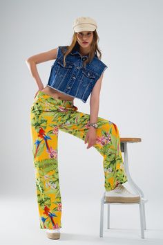 Step into paradise with these vibrant Yellow Pants, adorned with a tropical print featuring lush green leaves and vibrant pink flowers. Designed to make a statement, these wide-leg pants are perfect for embracing the spirit of spring and summer.  Crafted from lightweight woven fabric with a polyester lining, these pants offer a comfortable and breathable feel that's ideal for warm weather. The high waist rise and wide leg silhouette create a flattering and elongating effect, perfect for pairing with your favorite basic tops.  With a zip side closure, these pants offer ease of wear and a secure fit. Whether you're heading to a party or simply enjoying a sunny day out, these pants are sure to turn heads with their bold tropical print and relaxed fit.  Our model, standing at 5'10'' with measu Tan Scarf, The Color Yellow, Yellow Pants, Skirt Jumpsuit, Scarf Headband, Pants Fit, Trouser Pants Women, Style Party, Romper Pants