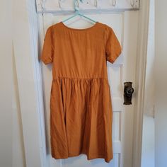 Tradlands Nico Dress On Size Xs. Fits Loose, Washed And Hung To Dry. Euc Orange Bohemian V-neck Boho Dress, Orange 3/4 Sleeve Summer Dress, Orange Bohemian V-neck Sundress, Orange V-neck Bohemian Sundress, Orange V-neck Rayon Dress, Dresses Xs, Colorful Dresses, Orange, Womens Dresses