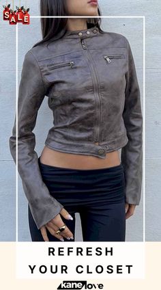 a woman wearing a gray leather jacket with the words refresh your closet on it