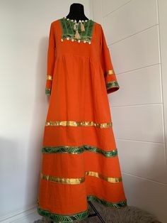 This is stunning vintage-style Afghan Dress is made from 100% cotton. The dress is suitable for all occasions. One size fits many as ,but it is most suited to medium body size. Dimensions: Shoulder: 39.5cm Length: 137cm Sleeve:51cm Waist size:98cm Bohemian Handloom Dresses For Festive Occasions, Fitted Bohemian Handloom Dresses, Cotton Handloom Dresses For Festivals, Festive Cotton Dress With Woven Motifs, Cotton Tunic Dress With Woven Motifs, Folk Festival Dress With Handloom Details, Folk Festival Handloom Dresses, Bohemian Cotton Handloom Dress, Cotton Dresses For Traditional Ceremonies