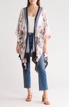 Love to layer this lightweight ruana that is covered in a floral design that is perfect for your next warm-weather adventure. 40" length (size O/S) Open front Short sleeves 100% rayon Hand wash, dry flat Imported Fall Floral Print Beach Outerwear, Floral Print Outerwear For Beach In Fall, Bohemian Floral Print Outerwear For Layering, Floral Print Outerwear For Fall Beach Outing, One Size Multicolor Floral Print Outerwear, Multicolor Floral Print One-size Outerwear, Multicolor Floral Print Outerwear One Size, Spring Patterned Open Front Outerwear, Patterned Open Front Outerwear For Spring