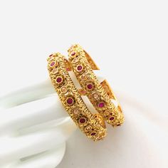 "2.6 Ruby Kundan Kada/Golden Kundan bangles/Handcarved Bangles/Jadau Bangles/Kundan Bridal bangle/Kundan wedding jewelry@AryaFashions This bangles set is handcrafted with love and creativity and are perfect for any occasion may it be engagement, Wedding or any bridal ceremonies or social get-together. Pair them up with Indian traditional outfit such as Anarkalis, Lehengas or Sarees and be the \"Diva\" at your next special occasions, or party. Handcrafted To Perfection Light Weight Perfect For In Wedding Filigree Bangle Jewelry, Wedding Filigree Bangle Bracelets, Wedding Filigree Bangle, Traditional Filigree Bangle For Festive Occasions, Festive Filigree Bangle, Gold Fusion Bangle For Weddings, Traditional Ceremonial Bangle With Filigree, Festive Fusion Openable Bangle, Festive Filigree Bangle For Festivals