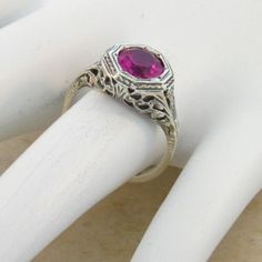 Vintage Estate 2.00 Carat Lab Created Ruby Solitaire Filigree Ring. Floral Designs. 925 Solid Sterling Silver. The Top Of The Ring Measures 3/8 Inches In Length. Set With One 6.5 mm High Quality Lab Created Ruby Stone. Stamped 925. Excellent Condition/Like New. Elegant Round Ruby Ring In Sterling Silver, Classic Ruby Ring For Valentine's Day, Silver Sterling Ruby Ring For Wedding, Classic Pink Ruby Ring For Formal Occasions, Elegant Wedding Ruby Ring With Diamond Cut, Formal Rings With Birthstone For Valentine's Day, Intricate Ruby Wedding Ring, Formal Birthstone Rings For Valentine's Day, Pink Birthstone Ring For Formal Occasions