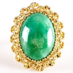 18k Yellow Gold Oval Cabochon Jade Solitaire Cocktail Ring 6.38gMetal Information: 18k Yellow GoldTotal Weight: 6.38gBand Width: 1.95mmSize: 6.5Stone InformationMain StoneGem Type: JadeShape: Oval Cabochon (16mm x 12mm)Color: GreenClarity/Quality: ANumber of Stones: 1Estimated Retail Price: $2005.00OUR PRICE: $1600.00SizingMany of our pieces can be re-sized at the buyers request. Please email us if you require our skilled professional services.45683 Yellow Gold Oval Cabochon Gemstones, Formal Oval Cabochon Emerald Ring, Formal Emerald Cabochon Ring, Oval Cabochon Opal Ring In Fine Jewelry, Yellow Gold Emerald Ring With Oval Cabochon Bezel Setting, Oval Cabochon Opal Ring Fine Jewelry, Yellow Gold Emerald Ring With Bezel Setting, Gold Emerald Cabochon Ring For Formal Occasions, Fine Jewelry Oval Cabochon Opal Ring