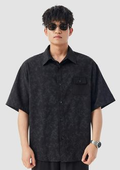 Elevate your casual wardrobe with our Oversized Bamboo Print Short Sleeve Button-up Shirt, an effortless fusion of style and comfort. Made from a blend of polyester and spandex, this shirt offers a light, airy feel with a touch of stretch for all-day ease. Its standout bamboo print adds a dose of laid-back sophistication, while the relaxed fit and classic Cuban collar structure the silhouette without sacrificing on comfort. Perfect for those who appreciate fine textures and subtle strength in th Black Button-up Camp Shirt For Beach, Black Button-up Camp Shirt For The Beach, Versatile Black Button-up Shirt, Black Short Sleeve Shirt With Button Closure For Spring, Casual Black Camp Shirt With Button Closure, Black Button-up Shirt For Vacation, Casual Black Button-up Camp Shirt, Black Beach Shirt With Pockets, Casual Black Hawaiian Shirt With Short Sleeves