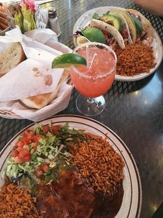 two plates of food and drinks on a table