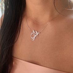 Our jewelry is always long lasting, beautiful, and of the highest quality. Our Persian (Farsi) and Arabic name necklaces are classic, unique pieces that are worth the investment. Personalize your necklace with this beautiful writing. We are happy to translate for you and we can't wait for you to fall in love with your very own piece. Compared to our print calligraphy Persian nameplates, this version has a script calligraphy style font. The letters and names have a more abstract, artistic style. Luxury White Gold Pendant Name Necklace, Luxury Sterling Silver Name Necklace For Formal Occasions, Luxury Sterling Silver Name Necklace For Formal Events, Luxury Custom Name Necklace In Sterling Silver, Luxury Custom Sterling Silver Name Necklace, Formal Nameplate Initials Necklace, Formal Initials Nameplate Necklace, Signature Sterling Silver Name Jewelry, Signature Sterling Silver Jewelry With Name