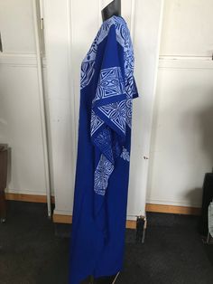 "A screen printed caftan tailored bu Indian Tailors in Fiji prior to 1972.Blue with white overprint which include Pacifica motifs.It is unworn. Fabulous symmetrical graphics which include a reference to Fiji Islands, It's label size is 32 which is to suit a 32\"bust. No faults. Still has original fold marks. These are the measurements, :- Bust 38\" Length from shoulder seam to hem 51\" Unstitched at sides for 21\" to allow ease of walking Overall width 38\" ( each side)" Traditional Pattern Maxi Kaftan For Festivals, Traditional Pattern Maxi Length Kaftan For Festivals, Traditional Maxi Kaftan For Festivals, Long Kaftan With Boho Print For Festival, Long Boho Print Kaftan For Festival, Bohemian Floor-length Dress With Traditional Patterns, Traditional Patterned Long Maxi Dress For Festivals, Traditional Pattern Long Maxi Dress For Festivals, Blue Long Kaftan With Boho Print