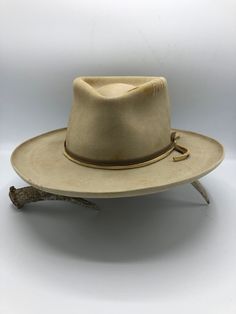 Western 50x in Sahara with custom distressing Teardrop crown Kettle curl on 3" brim Layered Elk leather accent bands Whipstitch on crown and brim Hand stitched Tonal Mountain detail Custom hand stitched initials upon request. This felt hat is made to order, please allow 6-8 weeks for delivery. Vintage Fitted Felt Hat For Ranch, Fitted Vintage Fedora For Ranch, Vintage Fitted Fedora For Ranch, Vintage Fitted Hat Bands For Rodeo, Fitted Vintage Hat For Ranch, Vintage Fitted Hat For Ranch, Vintage High Crown Brown Fedora, Vintage Brown Fedora With High Crown, Vintage Brimmed Fedora For Ranch