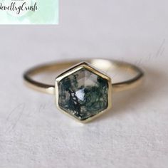 Vintage Hexagon Moss Agate Ring, 925 Silver Rose Gold, Moss Agate Engagement Ring, Bezel Set Green Gemstone Ring, Anniversary Stack Ring Main Stone: Moss Agate Main Stone Color: Green Main Stone Shape: Hexagon S I L V E R J E W E L R Y C A R E Silver is not the best friend of oxygen and sulfur; it can be oxidized and tarnished from time to time it is the nature of silver. To keep the silver shiny and prevent it from oxidizing fast, we would recommend the following instructions; * Avoid any chemical agents including perfume, makeup, and hair spray. * Avoid wearing silver jewelry to the beach, shower, or exercise. * Remove before you sleep, clean it with a silver cloth, and keep it in a dry area or in a small zip-lock package. G E M S T O N E C A R E Major semi-precious gemstones such as ame Octagon Sterling Silver Jewelry With Bezel Setting, Stackable Agate Jewelry As A Gift, Stackable Agate Jewelry For Gifts, Fine Jewelry Hexagon Bezel Setting, Unique Octagon Shaped Gift Ring, Hexagon Gemstone Jewelry Gift, Sterling Silver Hexagon Gemstone Jewelry, Octagon Gemstone For Jewelry Making, Fine Jewelry With Faceted Hexagon