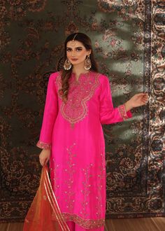 A brigh hot pink rawsilk long shirt minutely handworked with dabka, gota, sequence and zardozi, Paired with matching rawsilk worked Azar pants (Includes Shirt and pants) Party Lawn Suit With Dabka Work In Raw Silk, Pink Bollywood Raw Silk Salwar Kameez, Pink Raw Silk Bollywood Salwar Kameez, Pink Silk Salwar Kameez With Dabka Work, Pink Raw Silk Salwar Kameez For Eid, Bollywood Style Festive Raw Silk Lawn Suit, Party Kurta In Raw Silk With Dabka Detailing, Bollywood Style Raw Silk Lawn Suit For Festive Occasions, Festive Pink Lawn Suit With Dabka Work