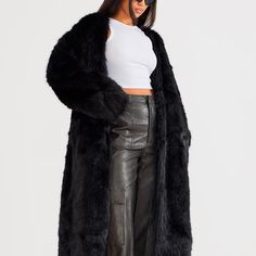 Take Your New Season Wardrobe That Extra Mile With This Black Faux Fur Collarless Coat. This Coat Includes A Black Faux Fur Material With A Collarless Design And A Relaxed Fit, What More Could You Want? Pair This Coat With Some Wide Leg Pants, Heels And Your Fave Accessories For A Look Everyone Will Want. Length Approx 114cm/45" Size 2. Brand New With Tags. I Am Happy To Answer Any Questions. Chic Solid Faux Fur Outerwear, Oversized Outerwear For Winter Nights Out, Chic Solid Color Open Front Outerwear, Long Fall Outerwear With Faux Fur Lining, Oversized Black Outerwear With Faux Fur Trim, Trendy Solid Color Party Outerwear, Elegant Long Outerwear For Night Out, Trendy Faux Fur Long Coat Outerwear, Oversized Long Fur Coat For Spring