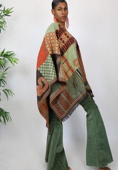 This gorgeous shawl is all about color. It features a beautiful ethnic inspired motif and features beautifully shades of green, orange and brown. One Size Fits All Bohemian Shawl Scarves For Fall, Green Bohemian Dupatta With Traditional Patterns, Brown Bohemian Shawl For Fall, Fall Bohemian Pashmina Shawl In One Size, Bohemian Fall Shawl Dupatta, Green Bohemian Pashmina Shawl, Brown Pashmina Shawl For Fall, Bohemian Green Pashmina Shawl, One-size Bohemian Pashmina Shawl