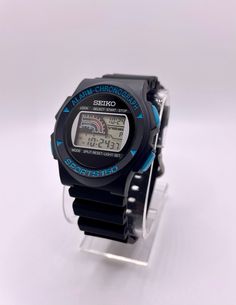 This is a sport digital Seiko G139-4A0A LCD men's wrist watch, NOS (New Old Stock) with different features such as Alarm / Stopwatch / Chronograph, manufactured in early 2000's.  -NOS (New Old Stock) -Vintage 2000 -Water resistance - 30m (3 ATM) -Stamp material - Rubber (not original) -Style - Sport  -Case Material - Plastic, black color with blue markings -Movement - Quartz -Features - Alarm / Stopwatch/ Chronograph -Display - Digital -Width with crown - 40mm -Lug width - 20mm -The case has minor scratches (see pictures) No factory box or original factory papers available.  The watch is overall in excellent condition and ready to be used.  *All images are of actual item and You will receive exactly the same item which shows in pictures. *If You receive the package with damaged or broken i Sporty Chronograph Watch With Analog Display For Outdoor, Functional Chronograph Watch With Analog Display For Sports, Functional Sports Chronograph Watch With Analog Display, Functional Stopwatch Watch Accessory With Round Dial, Sporty Watch Accessories With Analog Display For Sports, Casual Sports Watch Accessories With Stopwatch, Functional Chronograph Sports Watch With Analog Display, Sporty Analog Display Watch Accessories For Sports, Sporty Analog Display Sports Watch