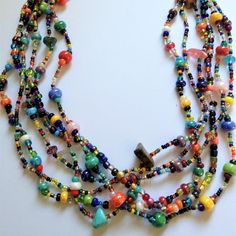 Artisan Czech Glass Bead 6 Strand 18" Long Fashion Statement Necklace Multi-Color Brights A Total Length Of 18" Long, With Glass Beads & Semi Precious Stone Chips. Easy To Open/Close Magnetic Clasp. One Of A Kind Necklace Handcrafted/No Two Are Exactly Alike Czech Glass Beads Are Know World Wide For Their Quality, Vibrant Colors Handmade In Guatemala Using Artisan Crafted Czech Glass Beads. Principles Of Fair Trade Are Upheld. Spiritual Multicolor Beaded Necklaces, Artisan Multicolor Multi-strand Beaded Necklaces, Artisan Multicolor Glass Beaded Necklaces, Artisan Multicolor Glass Necklaces, Artisan Multicolor Glass Necklace, Spiritual Multicolor Polished Beads Necklace, Multicolor Polished Czech Glass Beaded Necklaces, Multicolor Czech Glass Bead Necklaces, Multicolor Polished Czech Glass Necklaces