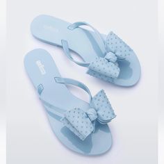 New In Box Light Blue Synthetic Flip Flops For Summer, Light Blue Flat Flip Flops For Summer, Light Blue Synthetic Flat Flip Flops, Light Blue Casual Sandals For Party, Blue Synthetic Flip Flops For Spring, Blue Slip-on Jelly Sandals For Summer, Blue Flat Heel Synthetic Sandals, Light Blue Flat Flip Flops For Vacation, Blue Synthetic Flat Heel Sandals