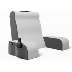 a white and gray chair with a bottle on the seat backrest, next to it's holder