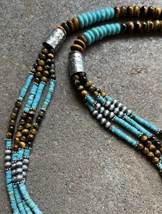 Hand-strung Blue Multi-strand Necklace, Long Blue Beaded Turquoise Necklace, Turquoise Long Beaded Necklace, Turquoise Long Necklace With Colorful Beads, Long Turquoise Necklace With Colorful Beads, Bohemian Blue Turquoise Necklace With Polished Beads, Artisan Blue Beaded Necklace With Natural Stones, Bohemian Blue Oval Beads, Gems, And Cabochons, Turquoise Natural Stones Long Beaded Necklace