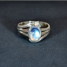 Sterling silver ring with blue moonstone setting, available in the following finger sizes:   UK sizes: K, L, N, O, Q & S.  U.S. sizes: 5 ½, 6, 7, 7 ½, 8 ½ & 9 ½.   DO NOT FORGET TO SEND YOUR FINGER SIZE WITH ORDER. Other stones available in same model: labradorite & lapis. One of the best selling rings. Technical details : silver weight 3gm./0,106oz.  Size of stone 8x6mm/0,32x0,24inch.  Width of ring including stone and silver 12mm/0,47inch.  Width of shank underneath 3,5mm/0,14inch. White Polished Moonstone Ring, Celestial Silver Gemstone Rings, Silver Moonstone Promise Ring With Polished Finish, Silver Polished Moonstone Promise Ring, Silver Moon-shaped Sterling Silver Opal Ring, Silver Sterling Silver Moon Shaped Opal Ring, Silver Sterling Silver Moon-shaped Opal Ring, Silver Moonstone Rings With Oval Cabochon, Silver Celestial Jewelry With Oval Cabochon