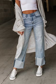 Take your look to new heights with these high waisted wide leg jeans. Crafted with premium light-wash denim, these jeans feature a button & zipper closure, a wide leg fit, and a wide cuffed hem with raw edge detail. Conquer the world in style! High waisted Button & zipper closure Wide leg fit Premium light-wash denim Wide cuffed hem with raw edge detail 68% Cotton/28% Polyester/2% Spandex/2% Viscose Fit and sizing: Features lots of stretchSmall - Waist: 27", Hip: 32", Inseam: 28.5"Medium - Waist Wide Leg Cuffed Jeans Outfit, Cuffed Jeans Outfit, General Clothes, Wide Cuff Jeans, High Waisted Wide Leg Jeans, Conquer The World, Sneakers Looks, Cuffed Jeans, Boutique Style