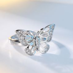 Add a silver-plated gleam to daily ensembles with this butterfly ring hosting a selection of glittering cubic zirconias. Face : 0.53" H Silver-plated copper / cubic zirconia Green Yellow Blue, Stylish Rings, Man Made Diamonds, Butterfly Ring, Red Green Yellow, Women Ring, Jewelry Ring, Lab Created Diamonds, Womens Engagement Rings