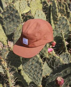 This hat is made of soft cotton and features an adjustable velcro back and fabric eyelets on the side panels. Size 1: Designed to fit kids aged 9 to 36 months (45-50cm) Size 2: Designed to fit kids aged 3 to 5 years (51-56cm) Brown Six-panel Cotton Snapback Hat, Brown Cotton Six-panel Snapback Hat, Brown Cotton Six-panel Trucker Hat, Brown Cotton Bucket Hat With Curved Brim, Brown Flat Bill Cotton Hats, Adjustable Cotton Hats For Everyday, Brown Cotton Fitted Cap, Brown Cotton Hat With Curved Brim, Adjustable Cotton Baseball Cap For Outdoor